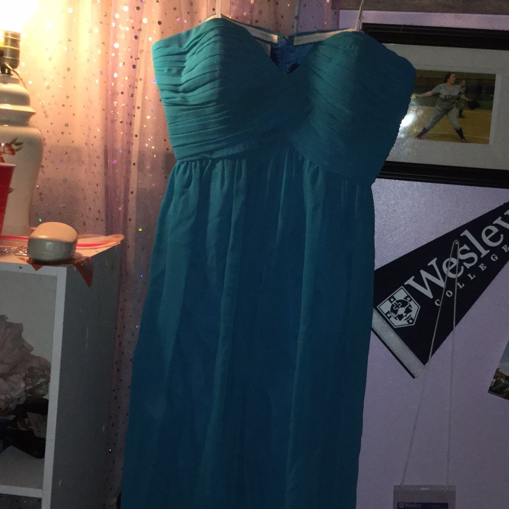 A short blue-greenish formal dress